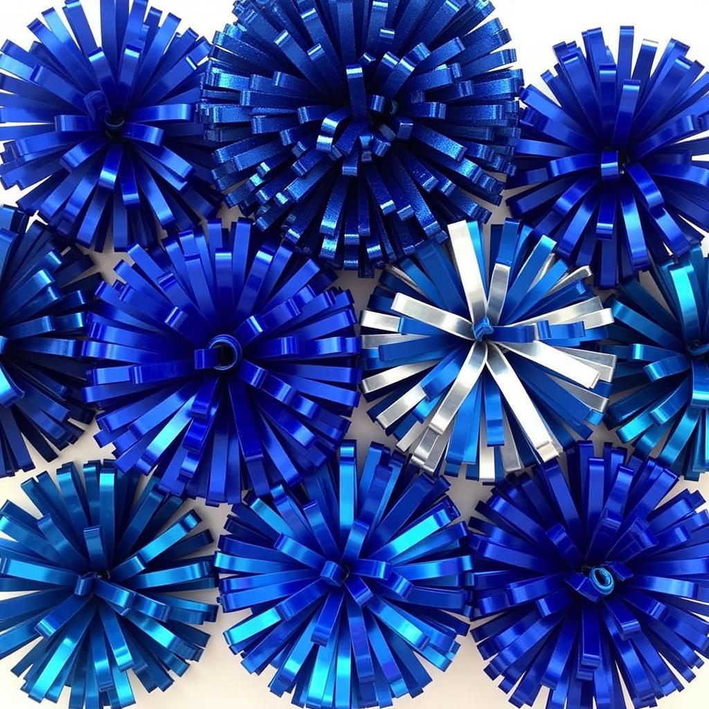 Variety of blue cheerleading pom poms showcasing different materials and styles