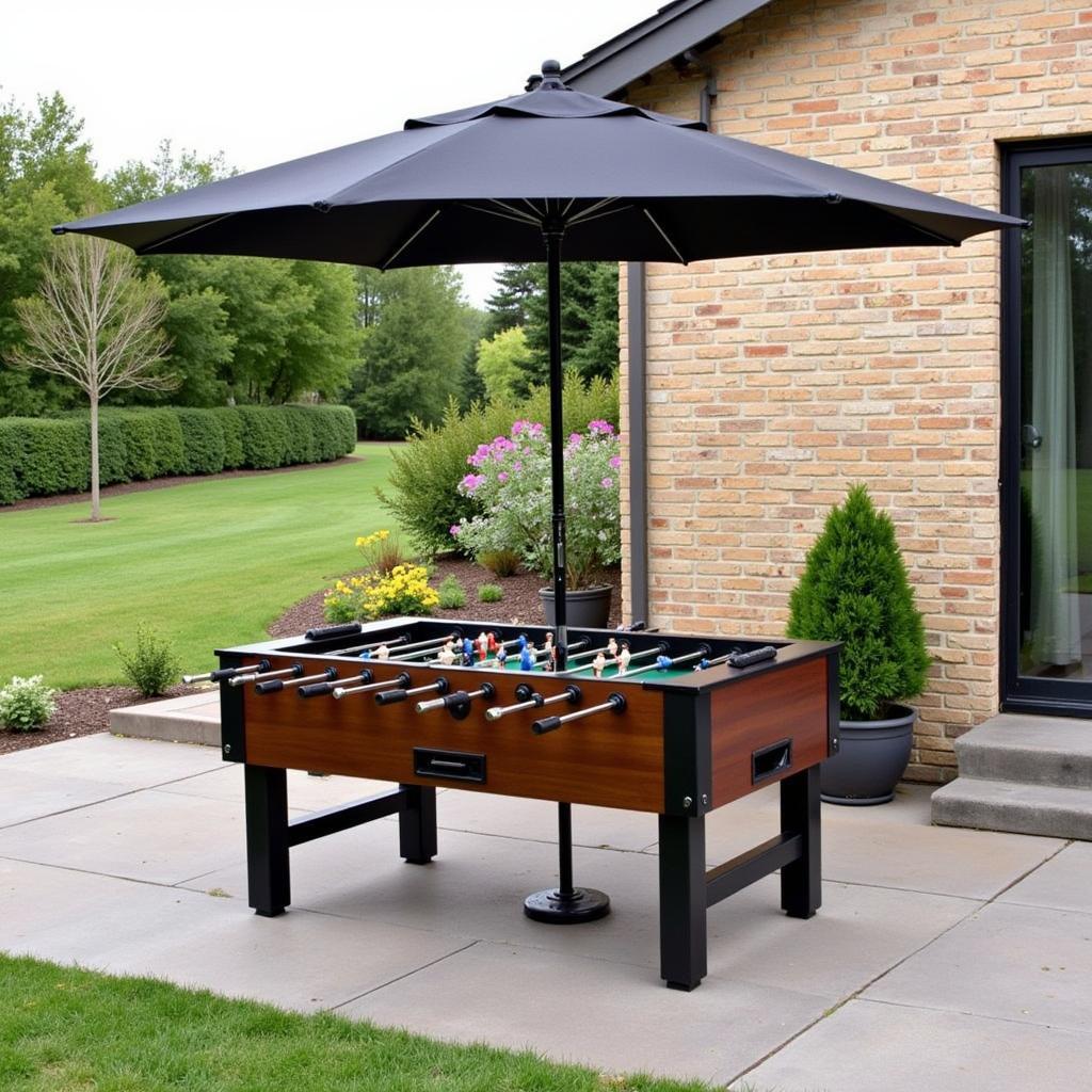 Covered foosball table on an outdoor patio