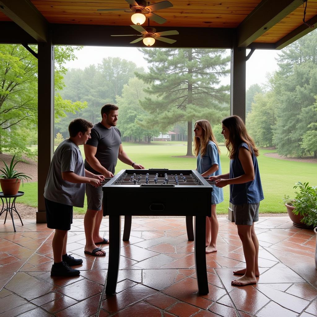 Family enjoying foosball on a covered patio