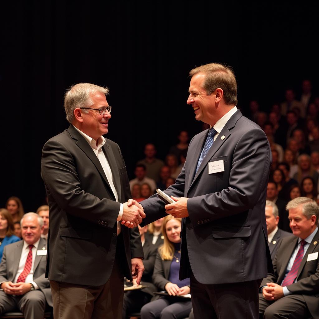 Hewitt Buck Dunn receiving an award