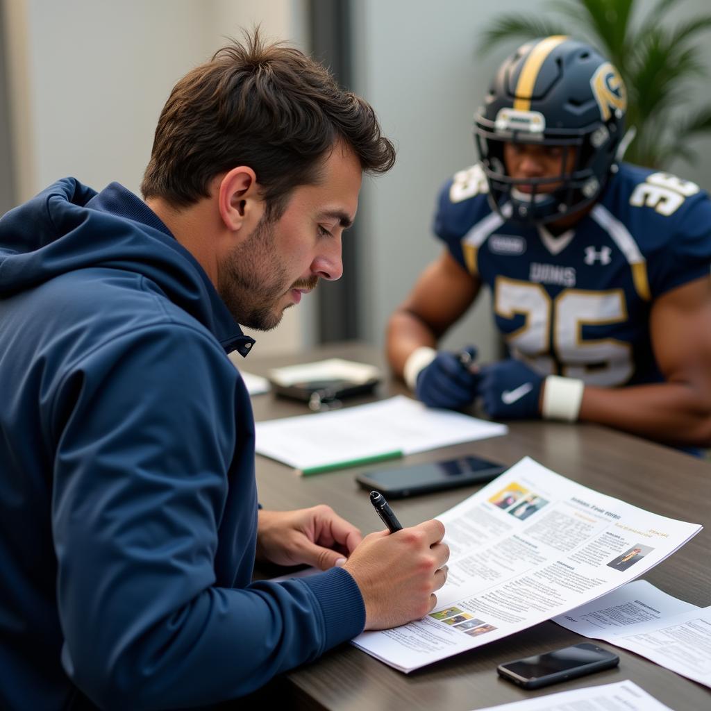 Coach reviewing a scouting report on a high school football player