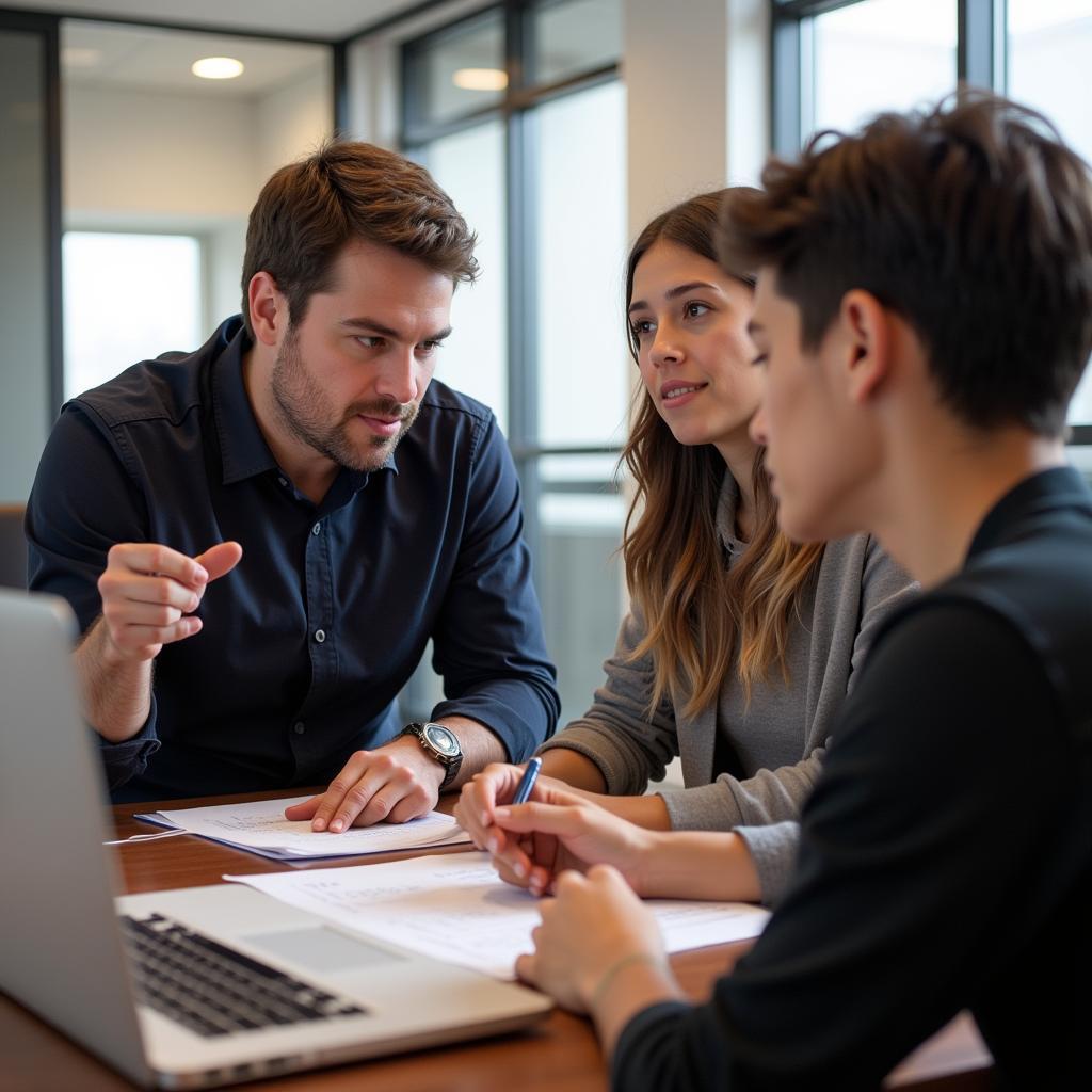 A LaunchX mentor providing guidance to a student during a one-on-one session.