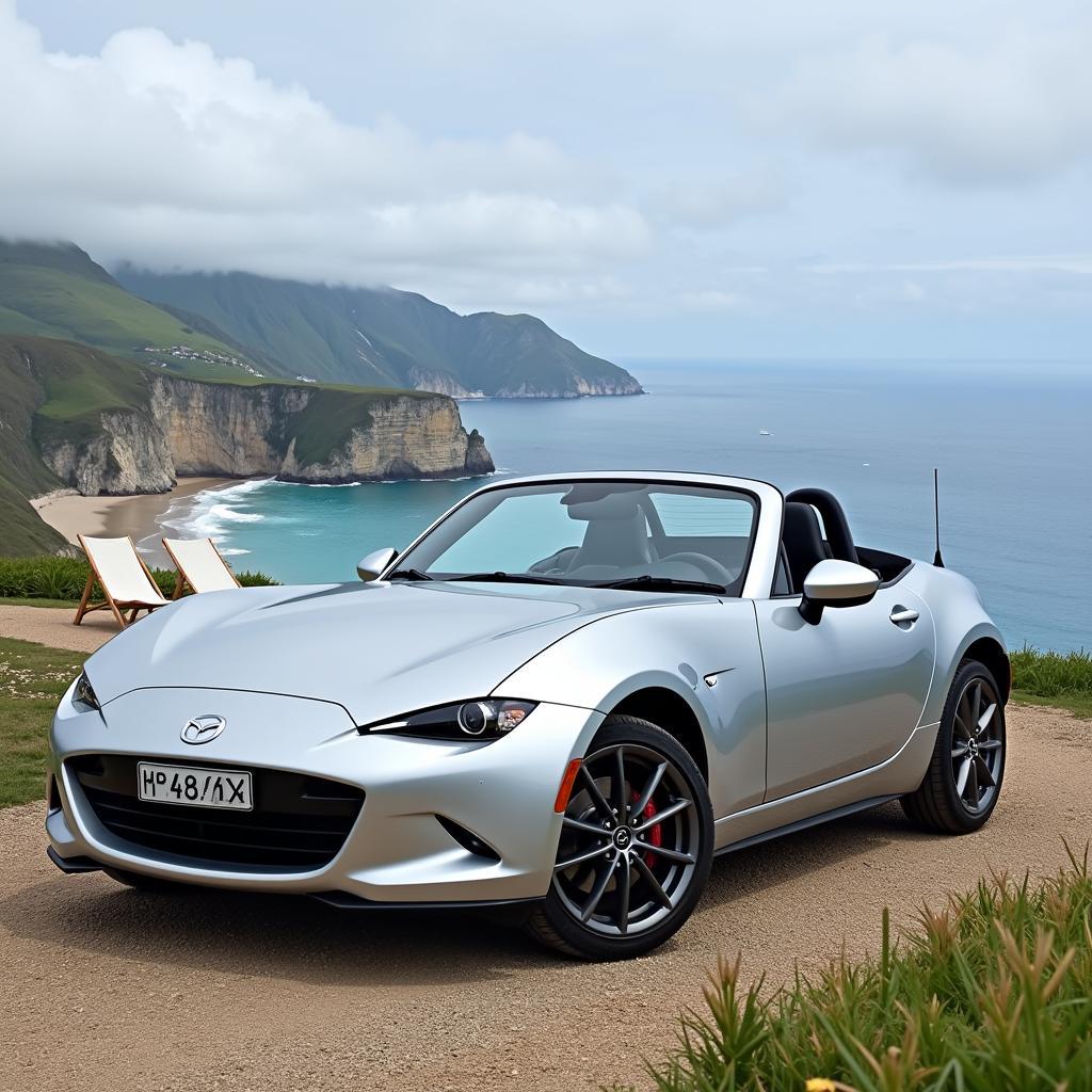 Mazda MX-5 Miata parked near the beach with its top down