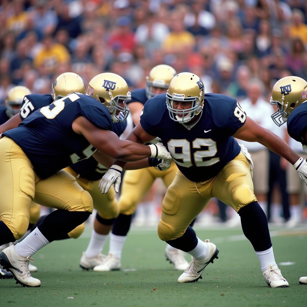 Notre Dame offensive line executing a run play