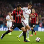 Slavia Praha and AC Milan midfielders battling for possession