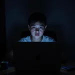 Teenager Using Computer