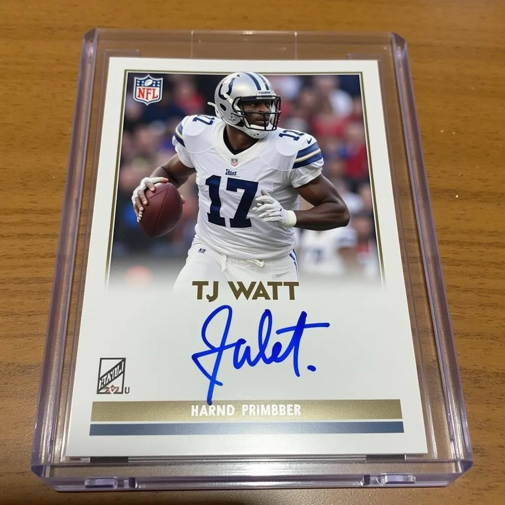 Signed TJ Watt football card in a protective case