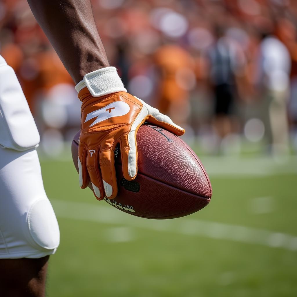 UT Football Player Wearing Gloves During a Game