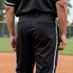 Youth black baseball pants with white piping detail