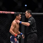 MMA Referee Ensuring Fighter Safety