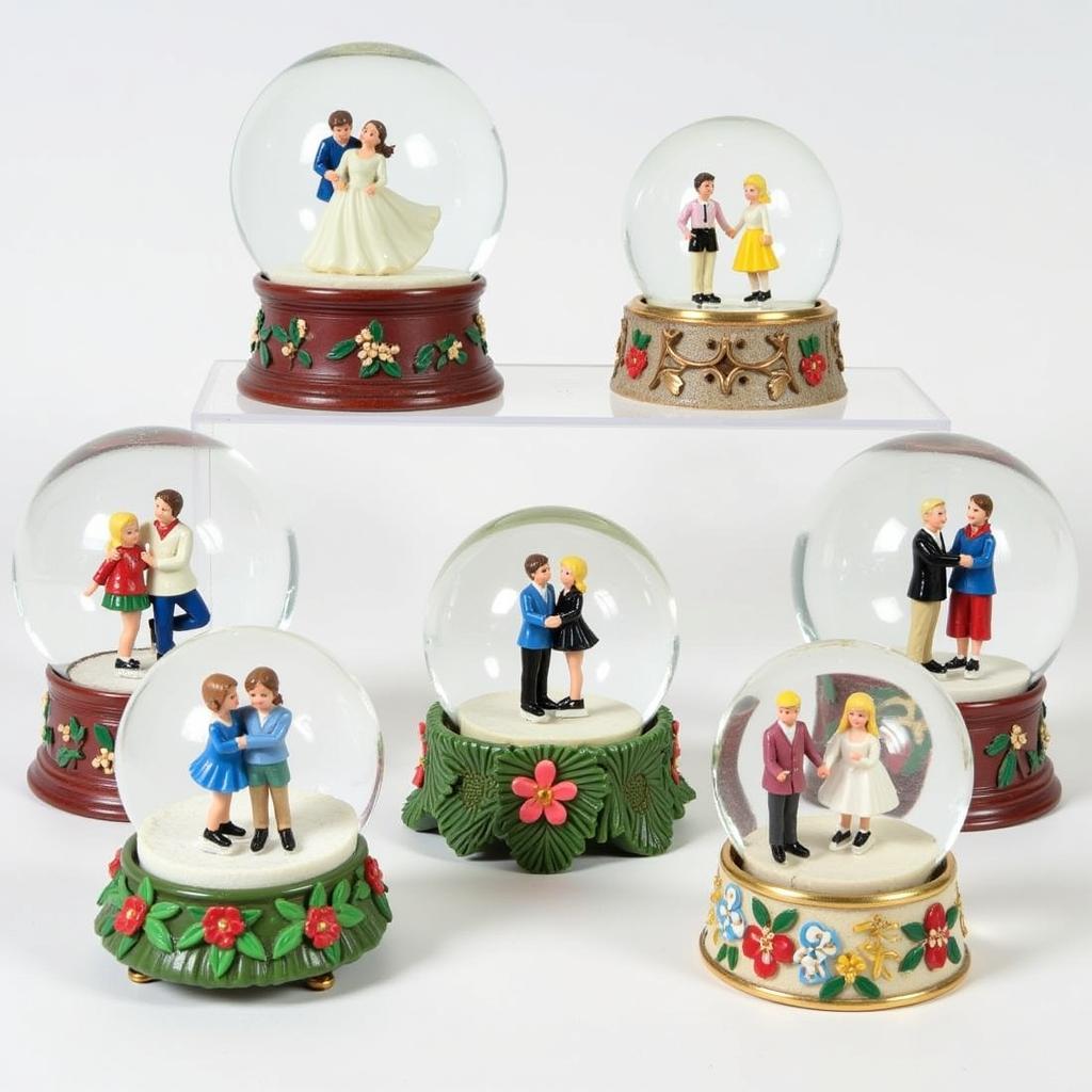 Different types of snow globes with ice skating themes displayed